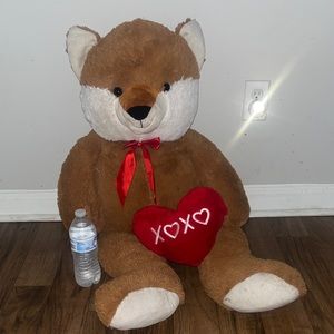 Large brown teddy bear, stuffed.